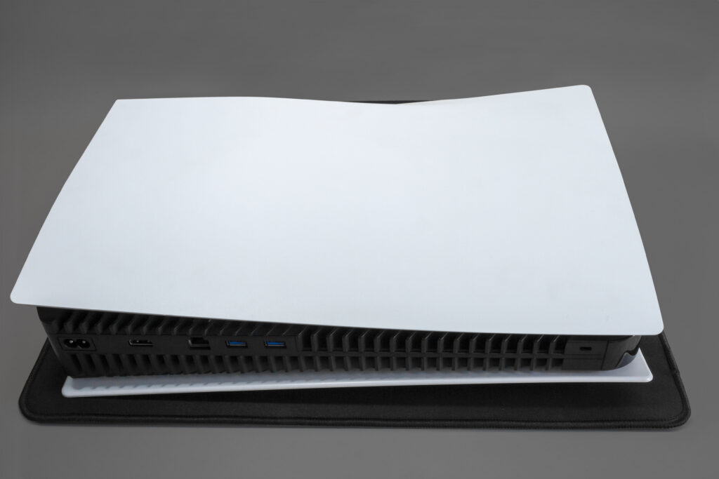 PlayStation console on gray background